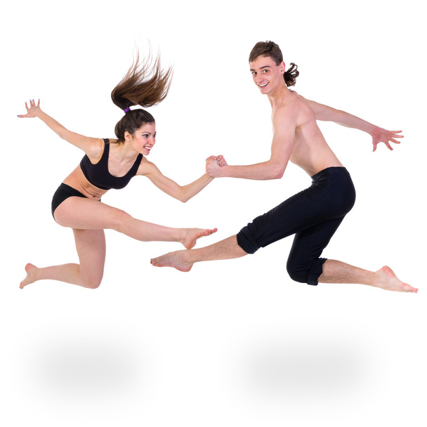 couple man and woman exercising fitness dancing on white background - Fotó, kép
