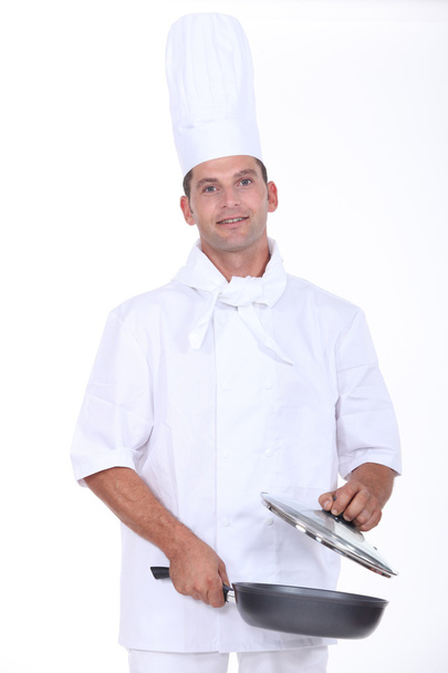 Chef holding a pan - Foto, imagen