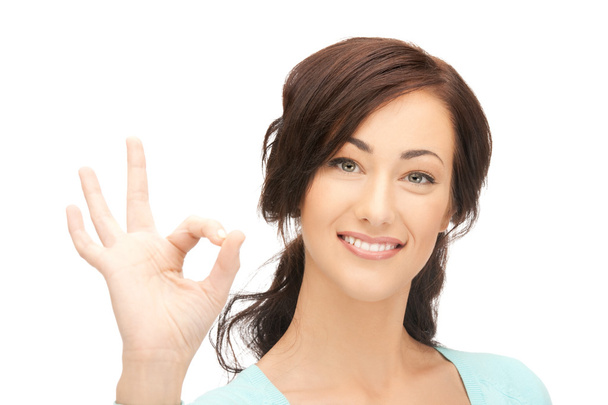 Young woman showing ok sign - Foto, imagen
