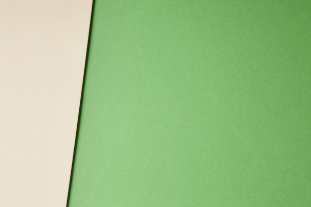 Цветной картонный фон в зеленом бежевом тоне. Копирование пространства
 - Фото, изображение