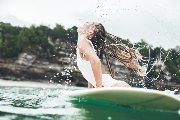 beautiful woman  in the ocean surf - 写真・画像