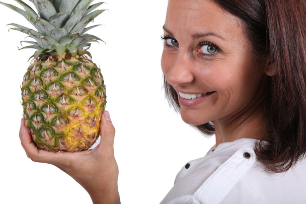 Woman holding fresh pineapple - Photo, Image