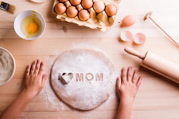 Mothers day composition. Baking cookies. Wooden background - Photo, Image
