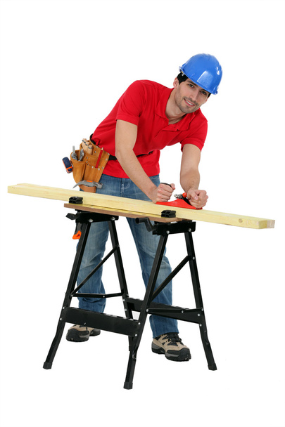 Craftsman working on a wooden board - Zdjęcie, obraz