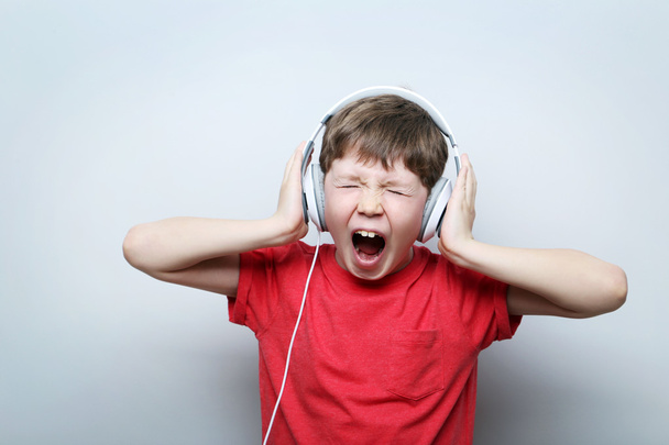 Portrait of young boy with headphones  - Zdjęcie, obraz