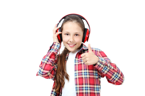 young girl with headphones  - Фото, изображение