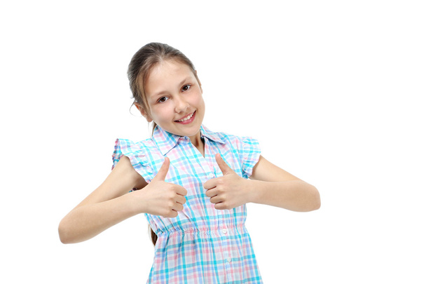 young girl thumbs up - 写真・画像