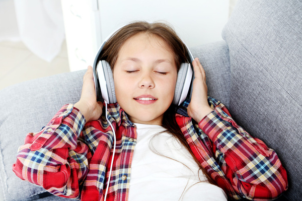 young girl with headphones  - Photo, Image