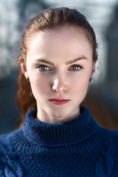 Portrait of the beautiful girl in blue sweater. - Fotografie, Obrázek