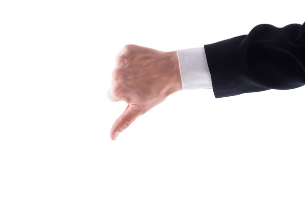 Man's hand showing thumb down on a white background. - Φωτογραφία, εικόνα