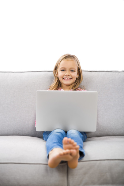 Little girl working with a laptop - Фото, зображення