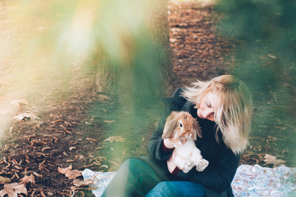 woman with rubbit, outdoor - Fotografie, Obrázek