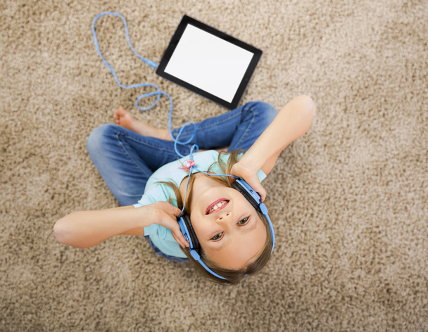 Little girl listen music with headphones - Photo, Image