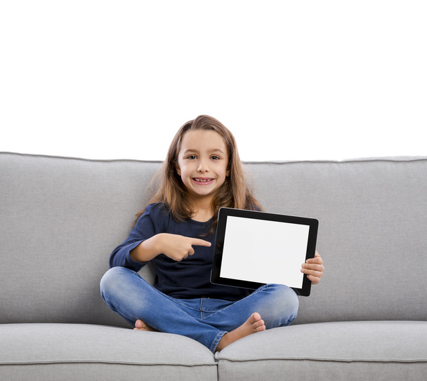 Little girl using a tablet - Фото, зображення