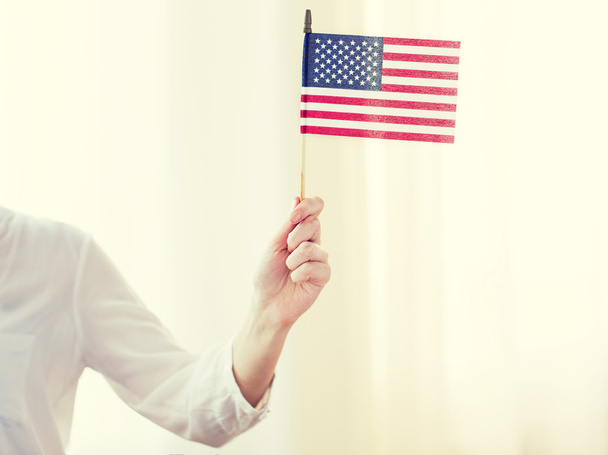 close up of woman holding american flag in hand - Foto, Imagen