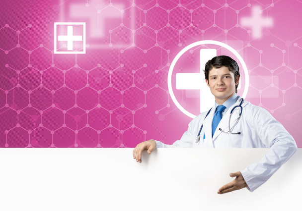 Doctor with white blank banner - Valokuva, kuva