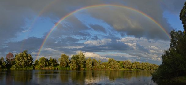 rainbow over river - Fotó, kép