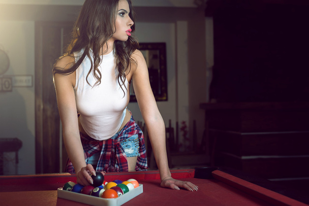 Female pool player setting balls - Photo, Image