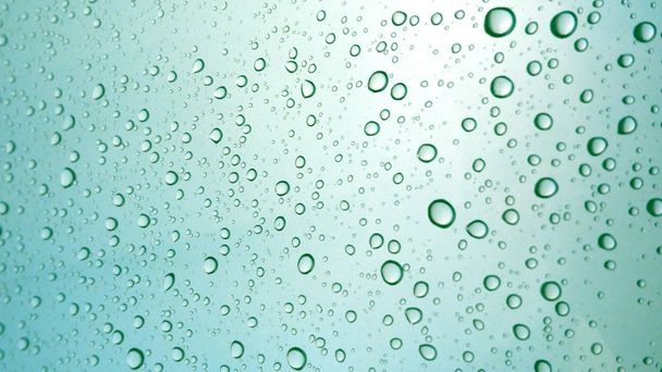Close-up of water drops on glass surface as background - Photo, Image