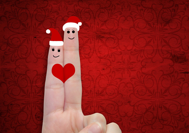  δάχτυλο ερωτευμένος με καπέλα Χριστουγέννων  - Φωτογραφία, εικόνα