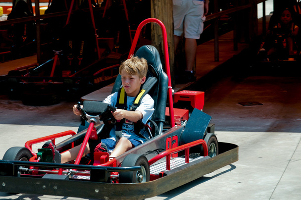 Cute little boy on red go cart. - Photo, Image