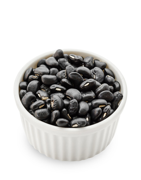 black bean seeds in white bowl. - Foto, immagini