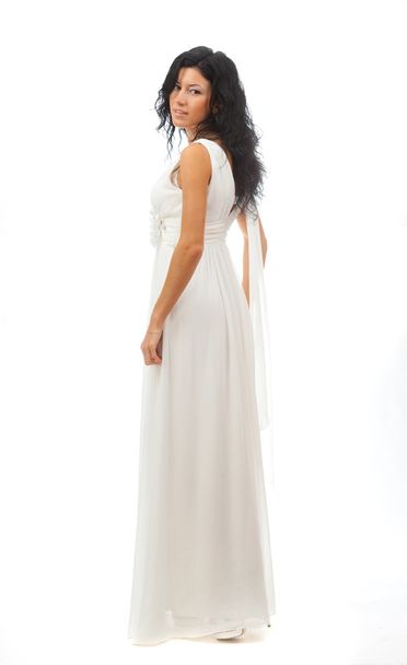 Beautiful girl in white dress standing on white background. - Foto, Bild