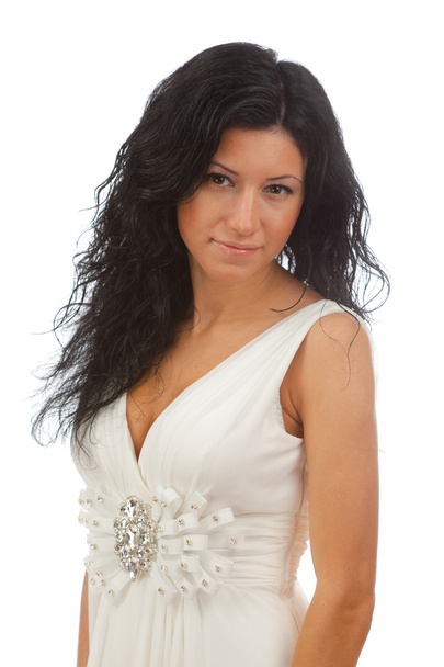 Beautiful girl in white dress standing on white background. - Foto, Imagen