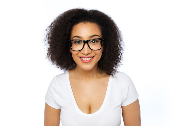 happy african woman or student girl in eyeglasses - 写真・画像