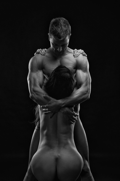 Nude sexy couple. Art photo of young adult man and woman. High contrast black and white muscular naked body - Zdjęcie, obraz