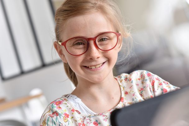 teenager with eyeglasses using tablet - Foto, Imagem