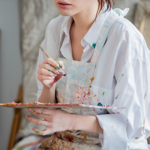 Female painter in her studio  - Fotografie, Obrázek