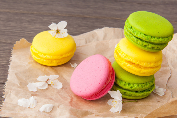 Macaroon on wooden & flowers - Photo, image