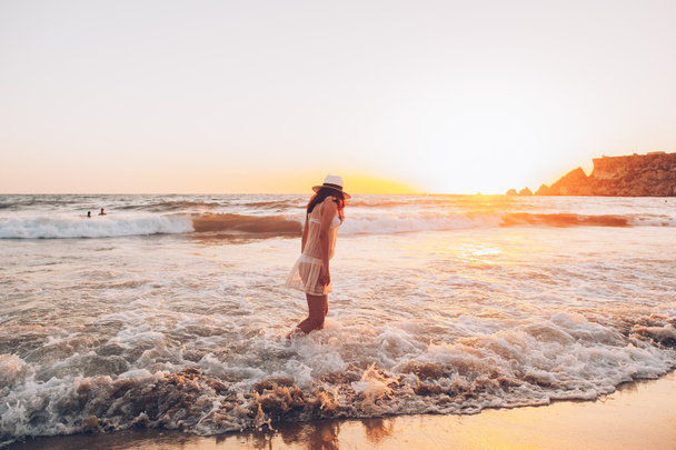 woman walks along beautiful seashore - Valokuva, kuva