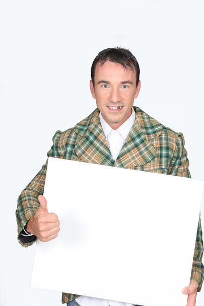 Man holding a white board - Valokuva, kuva