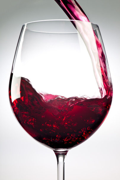elegant glass of red wine isolated on grey - Foto, Imagem