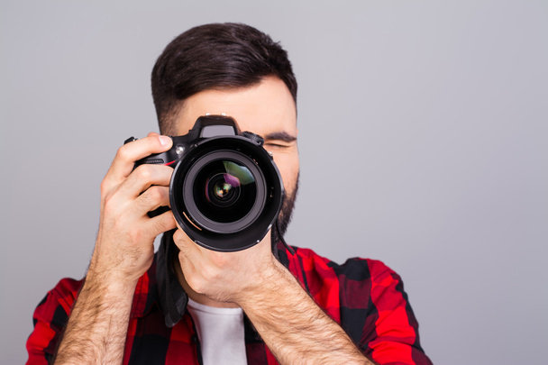 Portrait of  professional photographer with digital camera takin - Foto, immagini