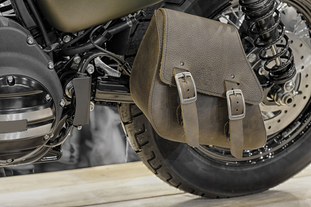 Close-up of leather single-sided swingarm bag of motorcycle  - Photo, Image