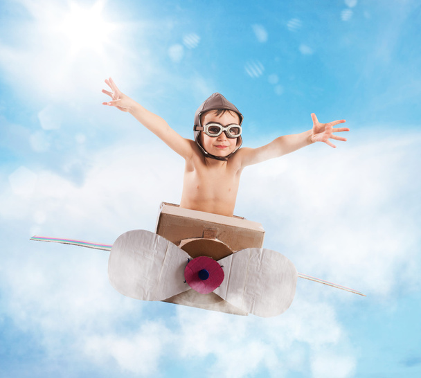 Child with cardboard airplane - Photo, Image
