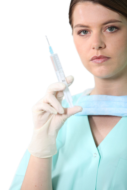 Nurse with needle - Foto, imagen