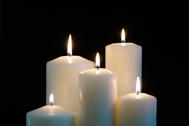 burning candles isolated on black background. - Foto, Imagen