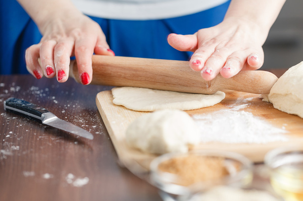Hands baking dough with rolling pin - Фото, изображение