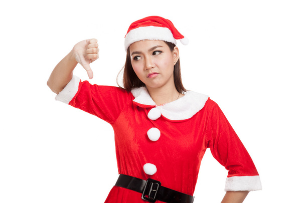 Asian Christmas girl with Santa Claus clothes thumbs down - Zdjęcie, obraz