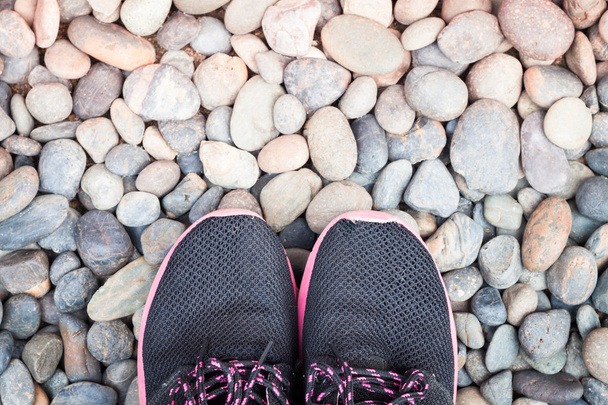 Running shoes in home garden on pebbles - Photo, Image