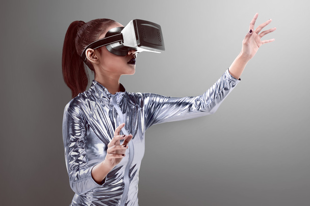 woman in latex costume and VR headset - 写真・画像