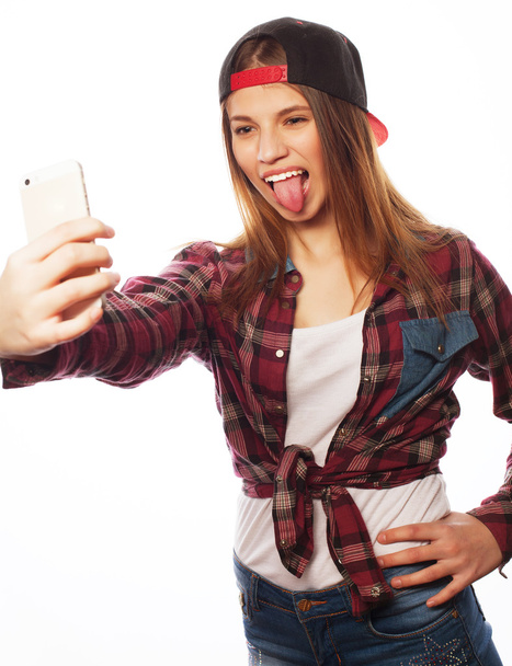 pretty teen girl wearing hat, taking selfies - Φωτογραφία, εικόνα