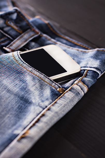 jeans and mobile phone - Photo, Image