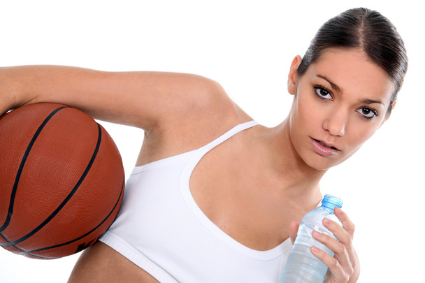 Woman with a basketball and bottle of water - Foto, imagen