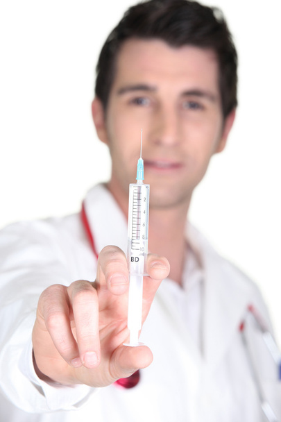 Doctor with an hypodermic needle - Foto, afbeelding