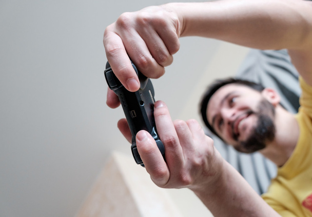 Bearded gamer with controller - 写真・画像